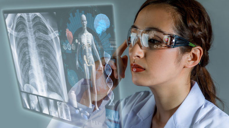 Female doctor looking at patient scans on hologram screen.
