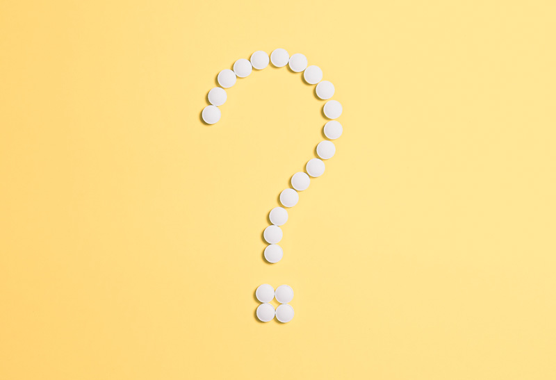 pills in form of question mark
