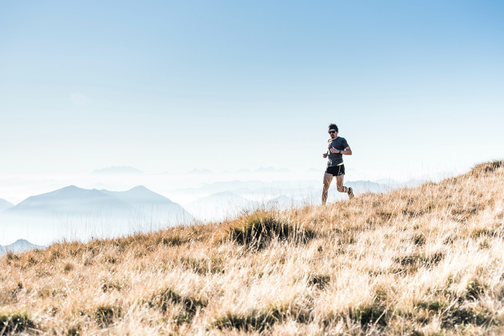 athlete running in mountains