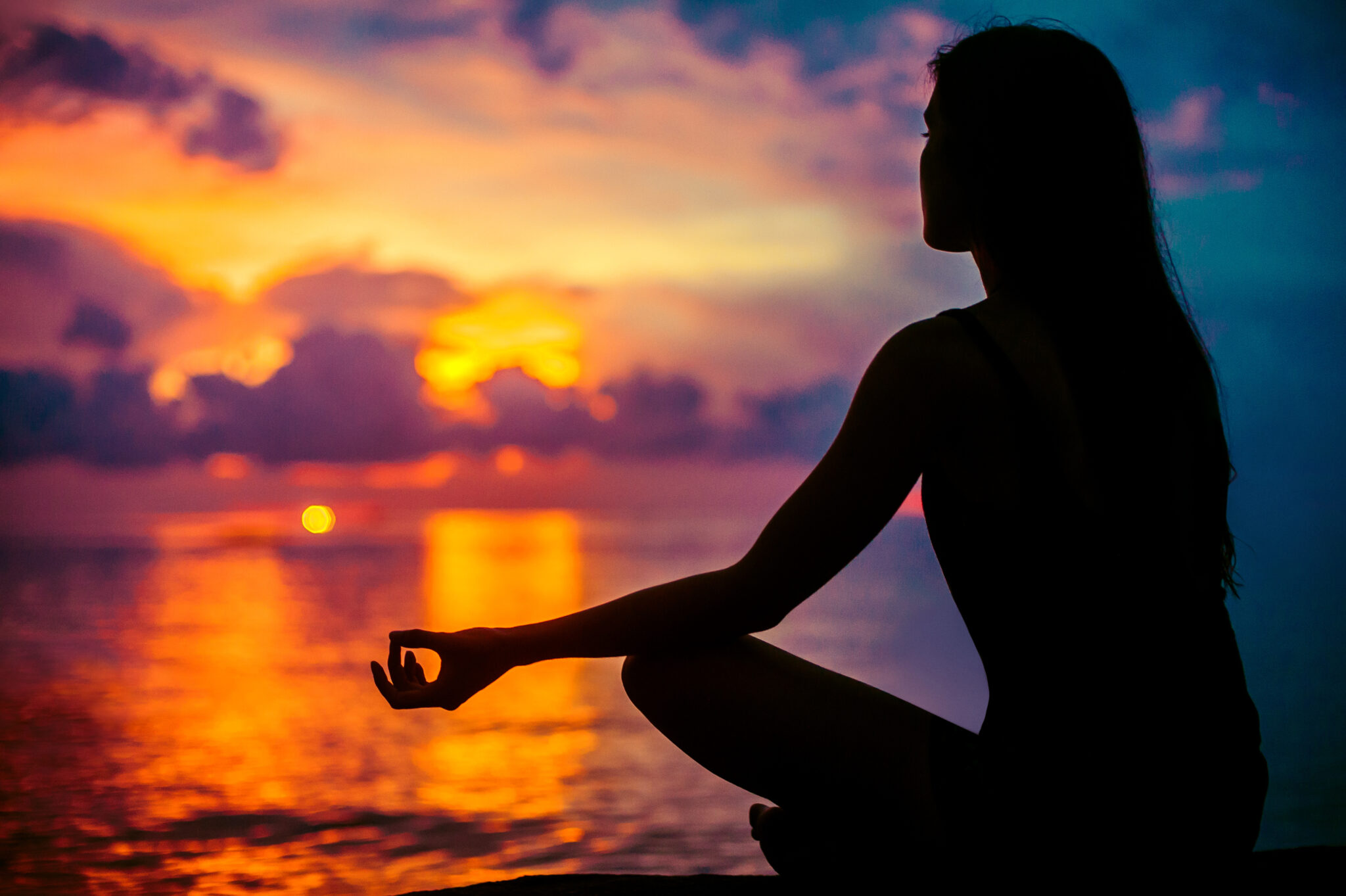 woman meditating outdoors
